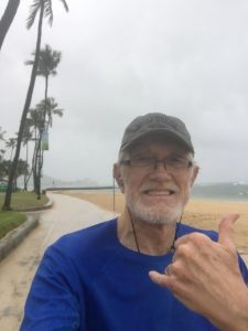 Running on the beach in the rain in Hawaii